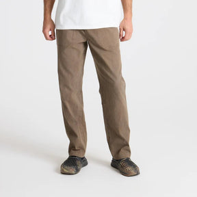 Men's tan straight-leg canvas pants with relaxed fit and subtle fading
