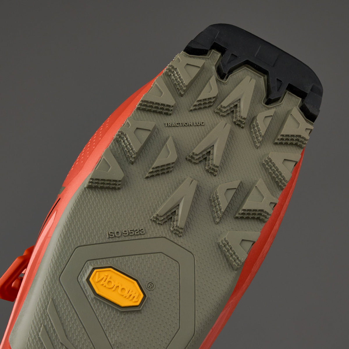 Bottom view of alpine ski boot sole showing Vibram traction lugs and ISO 9523 certification markings