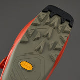 Bottom view of alpine ski boot sole showing Vibram traction lugs and ISO 9523 certification markings