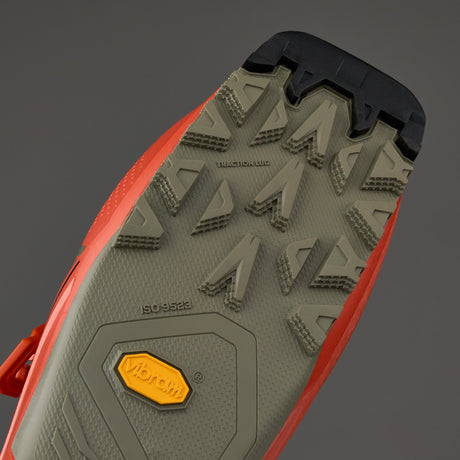 Bottom view of alpine ski boot sole showing Vibram traction lugs and ISO 9523 certification markings
