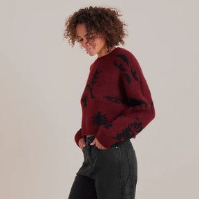 Women's burgundy and black floral jacquard knit crewneck sweater with long sleeves