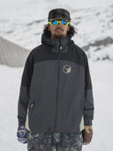 Armada Ansel 2L men's black and gray shell jacket worn in snowy conditions