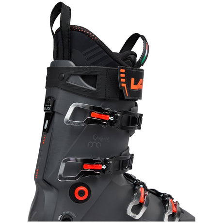 Lange alpine ski boot with four buckles, pull loop, and orange accent details