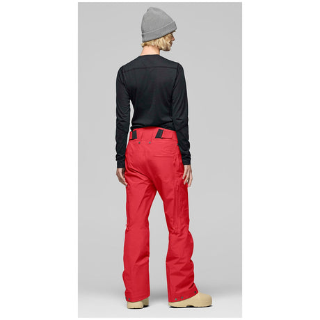 Norrona women's technical ski pants shown from behind on a model, featuring adjustable waistband.