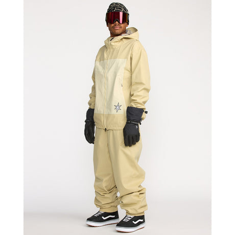 Men's technical snowboard jacket with hood, worn with matching pants and ski goggles