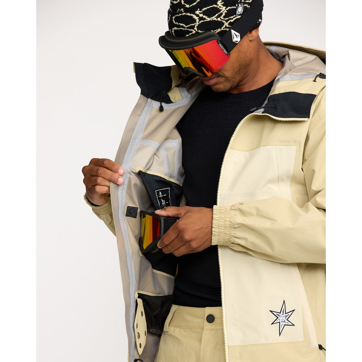 Volcom men's 3-layer snow jacket with interior goggle pocket and hood detail