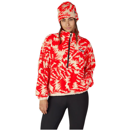 Women's pullover fleece anorak with half-zip collar and bold tie-dye print, shown with matching beanie.