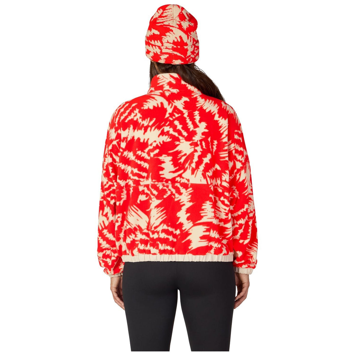 Women's patterned fleece anorak pullover shown from back with matching beanie hat