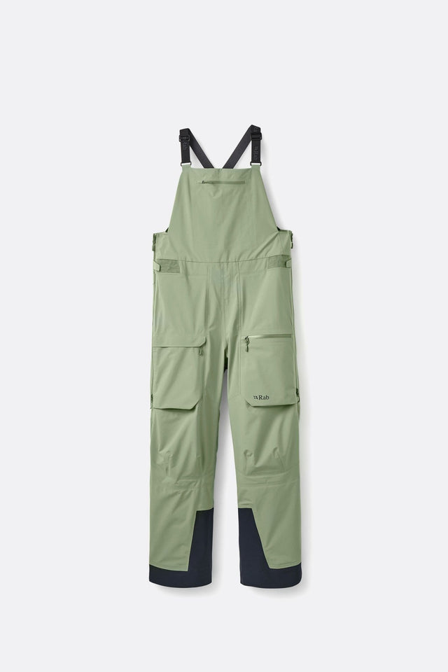Rab women's bib overall pants with adjustable straps, cargo pockets, and reinforced cuffs.