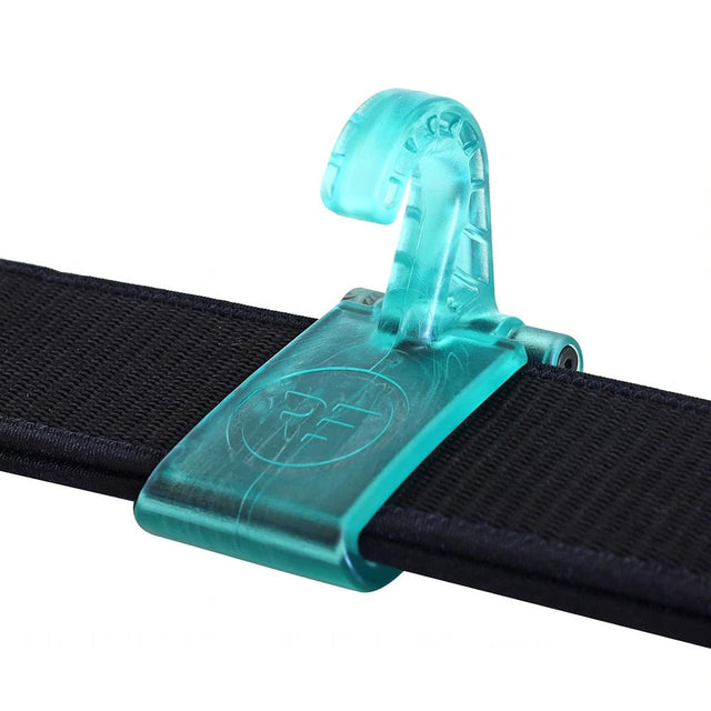 Teal plastic hook accessory clipped onto a black strap, close-up product image