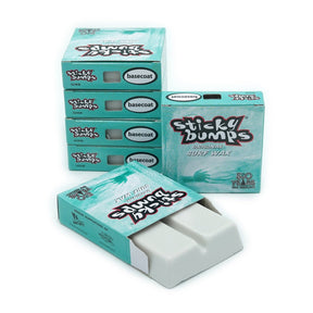 Sticky Bumps surf wax basecoat bars in turquoise packaging, stacked and opened