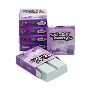 Sticky Bumps surf wax cold water formula boxes and wax bars on white background